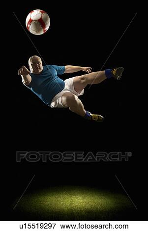 Large man doing flying volley View Large Photo Image Stock Photo - Large man doing flying volley. Fotosearch