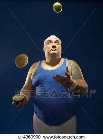 Large sportsman juggling food View Large Photo Image Stock Image - Large sportsman juggling food. Fotosearch