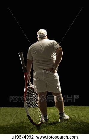 Large tennis player rear view View Large Photo Image Stock Image - Large tennis player rear view. Fotosearch