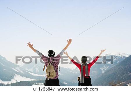 Stock Photo - Man and woman embracing sky. Fotosearch
