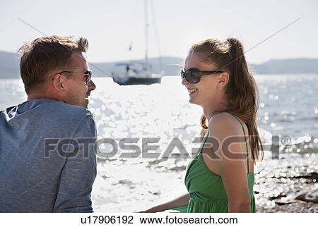Stock Image - Man and woman on beach. Fotosearch