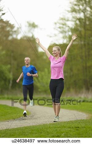 Man and woman running, competing View Large Photo Image Stock Photo - Man and woman running, competing. Fotosearch