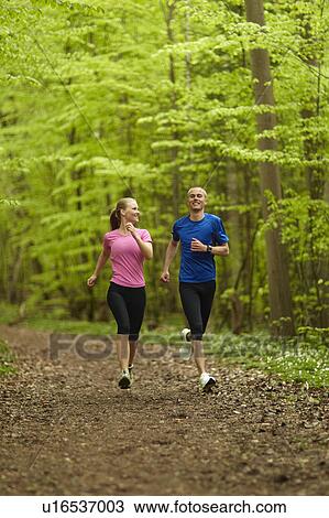Man and woman running, together View Large Photo Image Stock Image - Man and woman running, together. Fotosearch