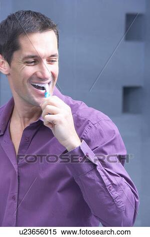 man brushing his teeth and laughing View Large Photo Image Stock Photography - man brushing his teeth and laughing. Fotosearch