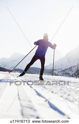 Stock Image - Man cross-country skiing. Fotosearch