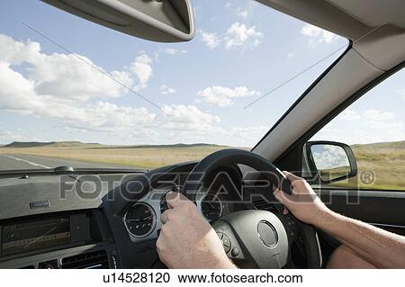 Stock Image - Man driving car. Fotosearch