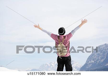Stock Image - Man embracing sky. Fotosearch