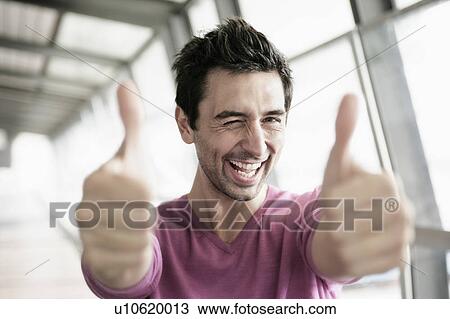 Stock Image - Man giving two thumbs up. Fotosearch