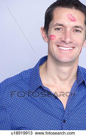 Stock Image - man headshot with lipstick on. Fotosearch