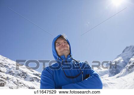 Stock Photo - Man in blue sport jackets in winter. Fotosearch