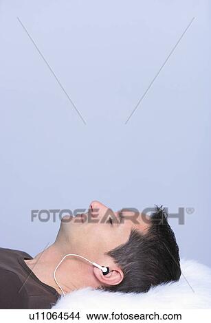man listening to music, profile shot View Large Photo Image Picture - man listening to music, profile shot. Fotosearch