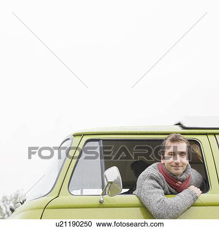 Man looking out of camper van View Large Photo Image Stock Image - Man looking out of camper van. Fotosearch