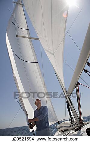 Man on yacht View Large Photo Image Picture - Man on yacht. Fotosearch