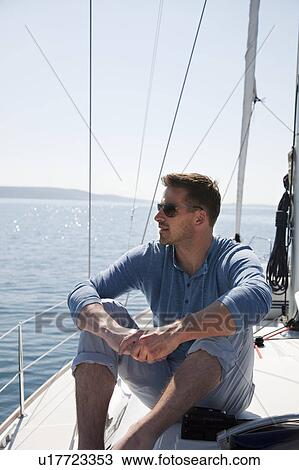 Man on yacht View Large Photo Image Stock Image - Man on yacht. Fotosearch
