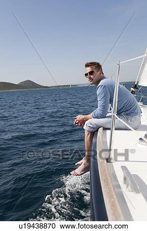Stock Image - Man on yacht. Fotosearch