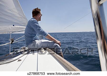 Man on yacht View Large Photo Image Stock Image - Man on yacht. Fotosearch