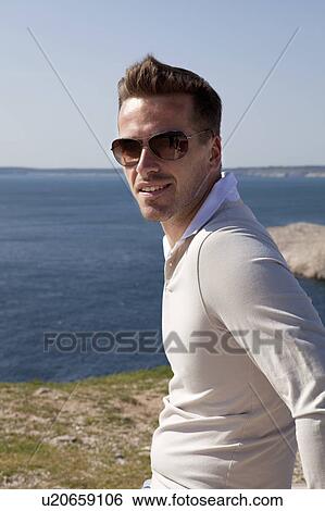Man overlooking sea View Large Photo Image Stock Photograph - Man overlooking sea. Fotosearch