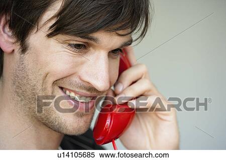 Stock Photography - Man phoning close-up. Fotosearch