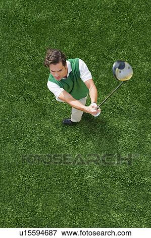 Stock Photo - Man playing golf. Fotosearch
