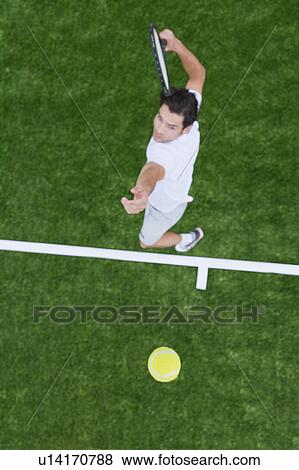 Man playing tennis View Large Photo Image Stock Photo - Man playing tennis. Fotosearch