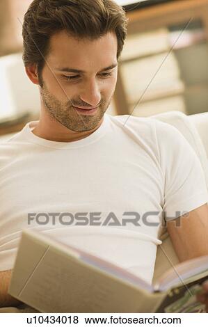 Man reading a book View Large Photo Image Stock Photo - Man reading a book. Fotosearch