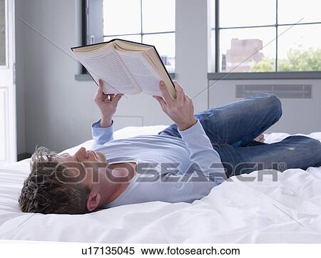 Stock Photography - Man reading book. Fotosearch