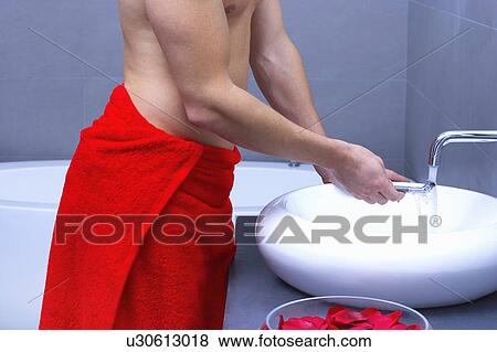 man rinsing his razor at the tap View Large Photo Image Stock Photo - man rinsing his razor at the tap. Fotosearch
