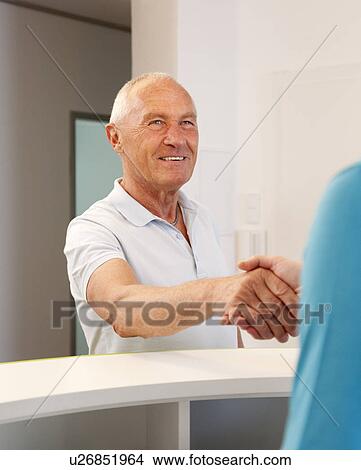Man shaking hands View Large Photo Image Picture - Man shaking hands. Fotosearch