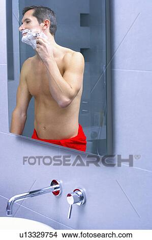 man shaving in a mirror View Large Photo Image Picture - man shaving in a mirror. Fotosearch