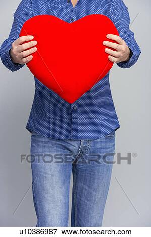 man showing a heart cropped shot View Large Photo Image Stock Photo - man showing a heart cropped shot. Fotosearch