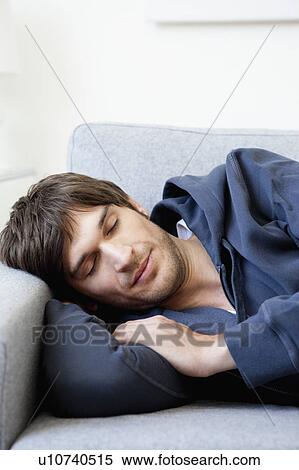 Man sleeping on sofa View Large Photo Image Stock Photography - Man sleeping on sofa. Fotosearch