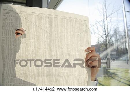 Man spying through hole in newspaper View Large Photo Image Stock Image - Man spying through hole in newspaper. Fotosearch