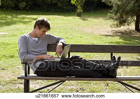 Stock Photo - Man using laptop. Fotosearch