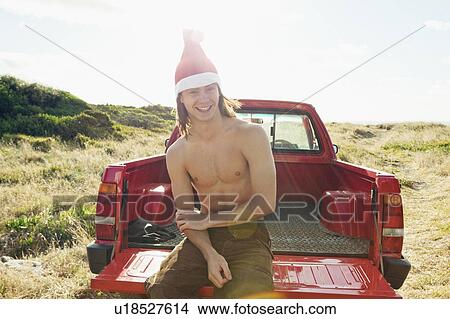 Man wearing christmas hat View Large Photo Image Picture - Man wearing christmas hat. Fotosearch