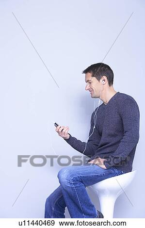 man with phone MP3 from profile View Large Photo Image Stock Photo - man with phone MP3 from profile. Fotosearch