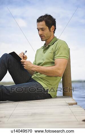 Man writing a letter View Large Photo Image Stock Image - Man writing a letter. Fotosearch
