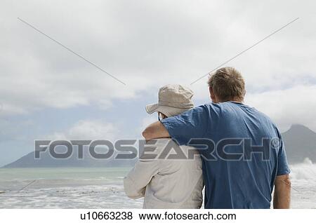 Mature man hugging mature woman View Large Photo Image Stock Photo - Mature man hugging mature woman. Fotosearch