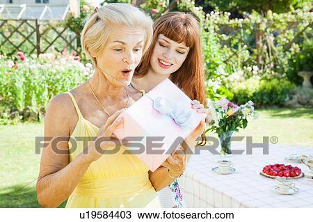mature woman has received present. View Large Photo Image Stock Image - mature woman has received present.. Fotosearch