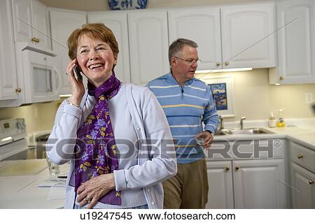 Mature woman on cell phone View Large Photo Image Stock Photography - Mature woman on cell phone. Fotosearch