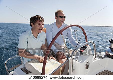 Men navigating yacht View Large Photo Image Picture - Men navigating yacht. Fotosearch