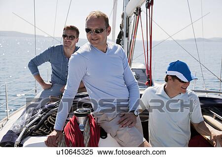 Stock Photography - Men on yacht. Fotosearch