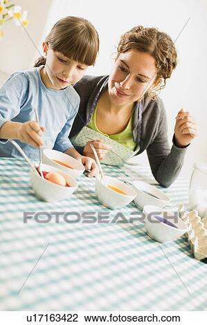 mother and child coloring Easter eggs View Large Photo Image Stock Image - mother and child coloring Easter eggs. Fotosearch
