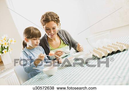 mother and child coloring Easter eggs View Large Photo Image Stock Photo - mother and child coloring Easter eggs. Fotosearch