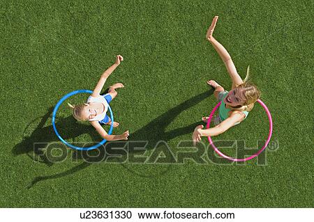 Mother and child playing in a garden View Large Photo Image Stock Image - Mother and child playing in a garden. Fotosearch