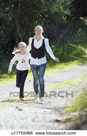 Stock Photograph - Mother and daughter enjoy time together. Fotosearch