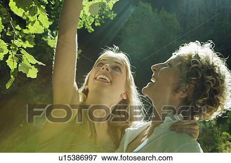 Stock Photo - Mother and daughter looking at tree. Fotosearch