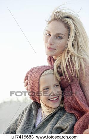 Stock Image - Mother and daughter on beach. Fotosearch