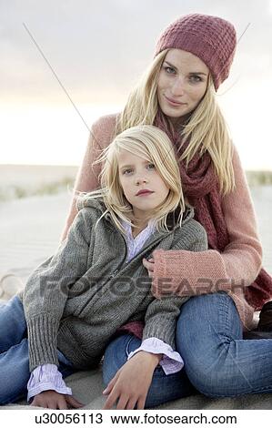 Mother and daughter on beach View Large Photo Image Stock Image - Mother and daughter on beach. Fotosearch