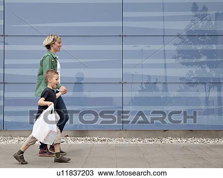 Stock Image - Mother and son shopping. Fotosearch