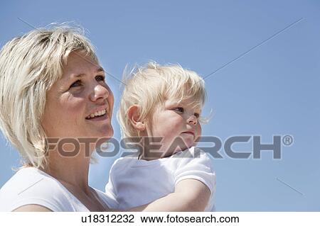 Mother holding son View Large Photo Image Stock Image - Mother holding son. Fotosearch